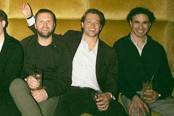 guys sitting back dressed nice in one of our lounges